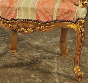 detail of carved apron, Louis XV-style gilded fauteuils, antique reproductions