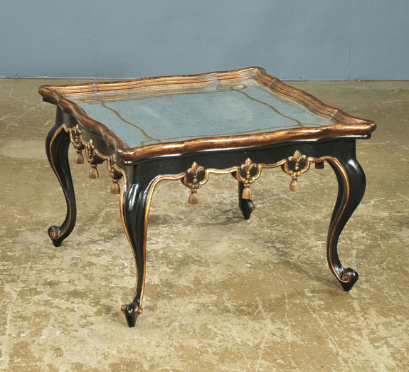 antique glass-topped cocktail table with black lacquer, gold gilding